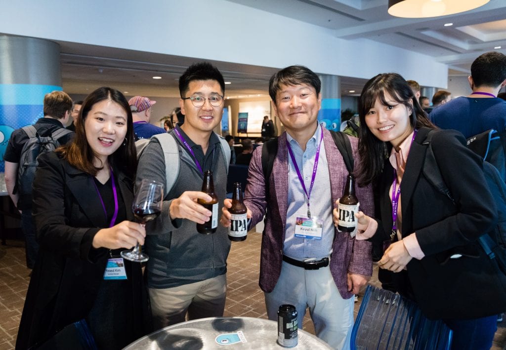 Attendees enjoying happy hour