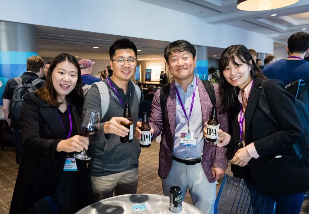 Attendees enjoying happy hour