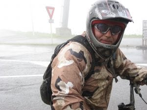 Photo: Vlad Zolotarov on his mountain bike in the rain.